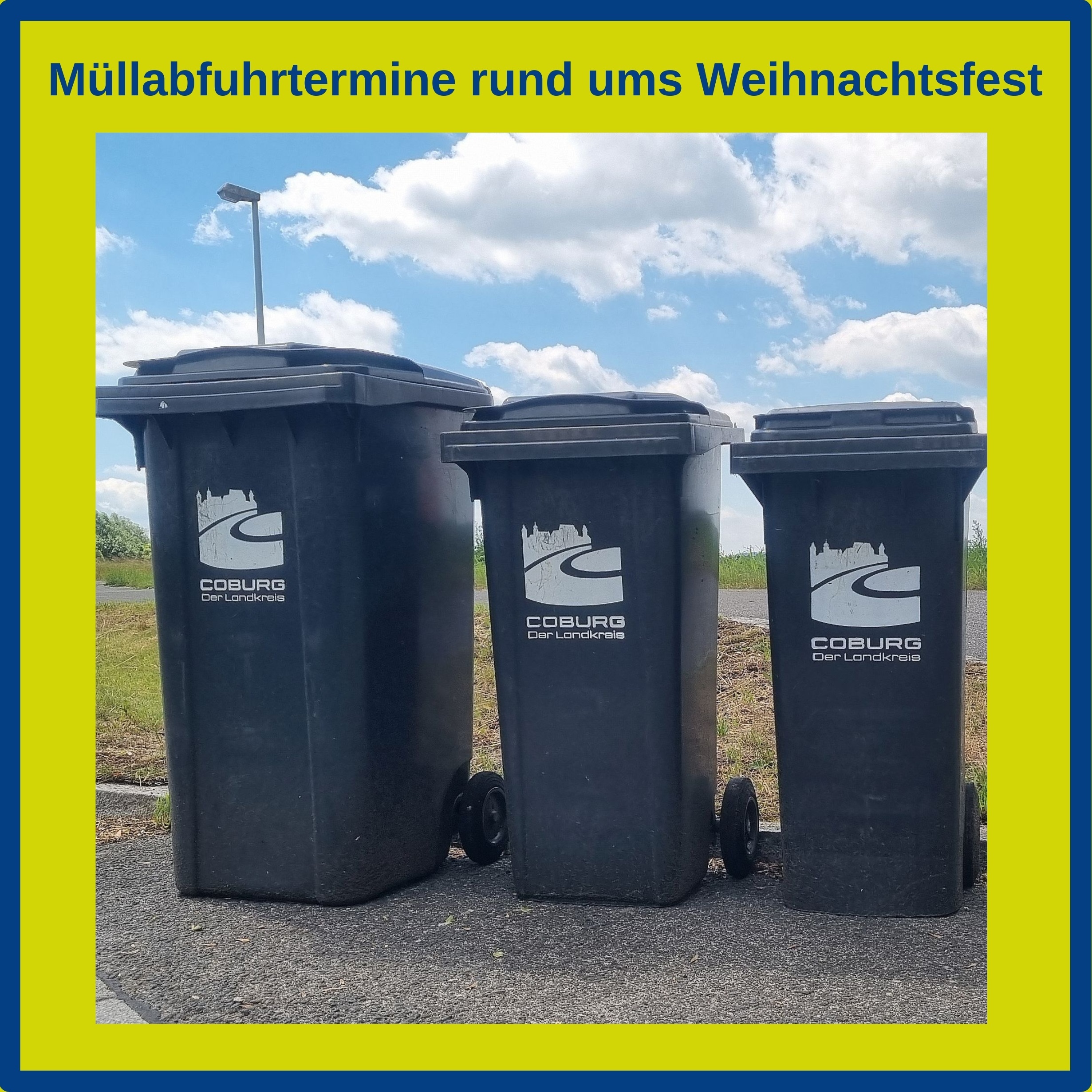 Drei Mülltonnen mit Landkreis-Logo stehen an einem Straßenrand.